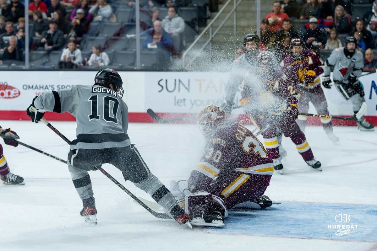 Omaha Maverick Jacob Guevin fights for the puck during a hockey match at Baxter Arena on Saturday, February 2, 2025, in Omaha, Nebraska. Photo by Collin Stilen.