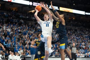 Creighton Bluejays Ryan Kalkbrenner gets fouled during a college basketball game against Marquette on February 8th, 2025 in Omaha, Nebraska. Photo by Brandon Tiedemann.