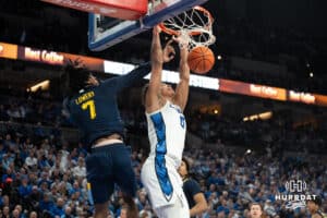 Creighton Bluejays Jasen Green dunks during a college basketball game against Marquette on February 8th, 2025 in Omaha, Nebraska. Photo by Brandon Tiedemann.