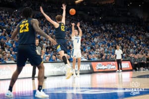 Creighton Bluejays Steven Ashworth shoots a three during a college basketball game against Marquette on February 8th, 2025 in Omaha, Nebraska. Photo by Brandon Tiedemann.