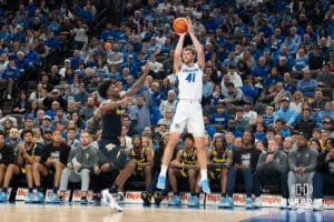 Creighton Bluejays Isaac Traudt attempts a three pointer during a college basketball game against Marquette on February 8th, 2025 in Omaha, Nebraska. Photo by Brandon Tiedemann.