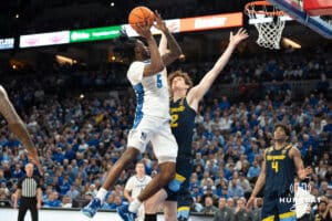 Creighton Bluejays Jamiya Neal attempts a layup during a college basketball game against Marquette on February 8th, 2025 in Omaha, Nebraska. Photo by Brandon Tiedemann.