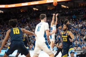 Creighton Bluejays Fedor Žugić attempts a three pointer during a college basketball game against Marquette on February 8th, 2025 in Omaha, Nebraska. Photo by Brandon Tiedemann.