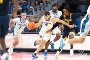 Creighton Bluejays Fedor Žugić pushes the ball up court during a college basketball game against Marquette on February 8th, 2025 in Omaha, Nebraska. Photo by Brandon Tiedemann.