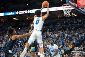 Creighton Bluejays Jasen Green catches a lob during a college basketball game against Marquette on February 8th, 2025 in Omaha, Nebraska. Photo by Brandon Tiedemann.