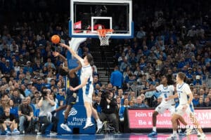 Creighton Bluejays Ryan Kalkbrenner blocks a shot during a college basketball game against Marquette on February 8th, 2025 in Omaha, Nebraska. Photo by Brandon Tiedemann.
