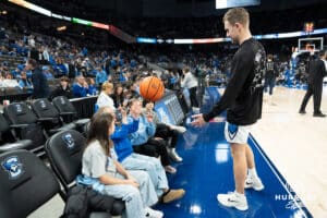 Creighton Bluejays Steven Ashworth talks with fans before a college basketball game against Marquette on February 8th, 2025 in Omaha, Nebraska. Photo by Brandon Tiedemann.