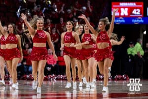Nebraska Cornhuskers Scarlets dance team runs out on the court to perform during a college women’s basketball game Michigan Wolverines on Wednesday, February 6, 2025, in Lincoln, Nebraska. Photo by John S. Peterson.
