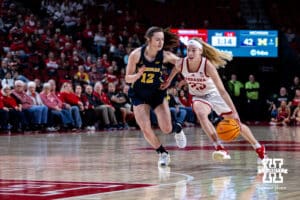Nebraska Cornhuskers guard Britt Prince (23) drives to the lane against Michigan Wolverines guard Syla Swords (12) in the second quarter during a college women’s basketball game on Wednesday, February 6, 2025 in Lincoln, Nebraska. Photo by John S. Peterson.