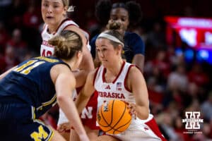 Nebraska Cornhuskers guard Callin Hake (14) dribbles the ball against Michigan Wolverines guard Greta Kampschroeder (11) in the second quarter during a college women’s basketball game on Wednesday, February 6, 2025 in Lincoln, Nebraska. Photo by John S. Peterson.
