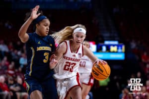 Nebraska Cornhuskers guard Britt Prince (23) dribbles the ball against Michigan Wolverines guard Mila Holloway (3) in the first quarter during a college women’s basketball game on Wednesday, February 6, 2025 in Lincoln, Nebraska. Photo by John S. Peterson.