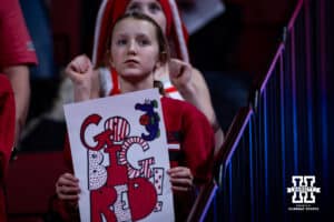 Nebraska Cornhuskers fan holding up at sign she during a college women’s basketball game against the Michigan Wolverines on Wednesday, February 6, 2025 in Lincoln, Nebraska. Photo by John S. Peterson.