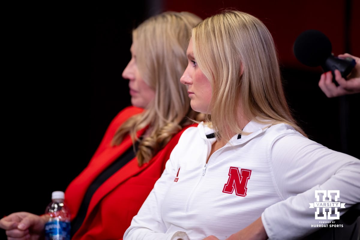 Welcome Dani Busboom-Kelly Celebration | February 6, 2025 Nebraska volleyball assistant coach Kelly Hunter watching a press conference after the Welcome to Dani Busboom-Kelly Celebration event Thursday, February 6, 2025 in Lincoln, Nebraska. Photo by John S. Peterson.
