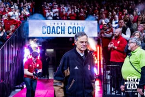 Retiring volleyball head coach John Cook passes walks out to be recognized by the fans at the first media break during a college basketball game against the Illinois Fighting Illini, Thursday, January 30, 2025, in Lincoln, Nebraska. Photo by John S. Peterson.