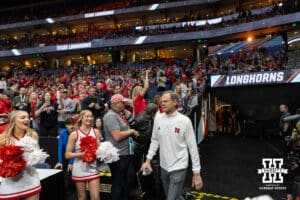 Nebraska head coach John Cook walks out to the court during the NCAA Finals against Texas on Sunday, December 17, 2023, in Tampa, Florida. Photo by John S. Peterson.