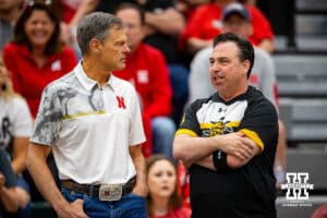 Nebraska Cornhusker head coach John Cook and Wichita State Shocker head coach Chris Lamb talk before the spring volleyball match Saturday, April 29, 2023, in Central City, Neb. Photo by John S. Peterson.