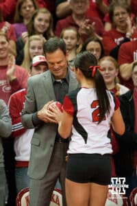 November 24, 2012: Lauren Cook of the Nebraska Cornhuskers gives her volleyball to her dad and head coach John Cook in her last regular season game on senior night. Nebraska takes on Northwestern in the last season regular match at the NU Coliseum in Lincoln, Nebraska. Nebraska defeated Northwestern 3 sets to 1. Photo by John S. Peterson.