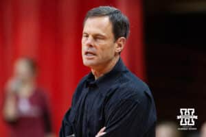 17 November 2010: Nebrakska head coach John Cook standing watching the action on the court against Oklahoma in Lincoln, Nebraska. Photo by John S. Peterson.