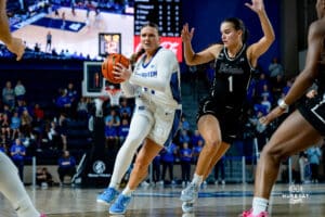 Creighton Bluejay Molly Mogensen looking to pass against Providence Friars Kylee Sheppard during a basketball game at Sokol Arena on Sunday, February 02, 2025, in Omaha, Nebraska. Photo by Collin Stilen.