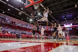Omaha Mavericks guard Ja'Sean Glover (5) makes a dunk against South Dakota Coyotes guard Chase Forte (9) in the second half during a college basketball game, Wednesday, January 29, 2025, in Vermillion, South Dakota. Photo by John S. Peterson.