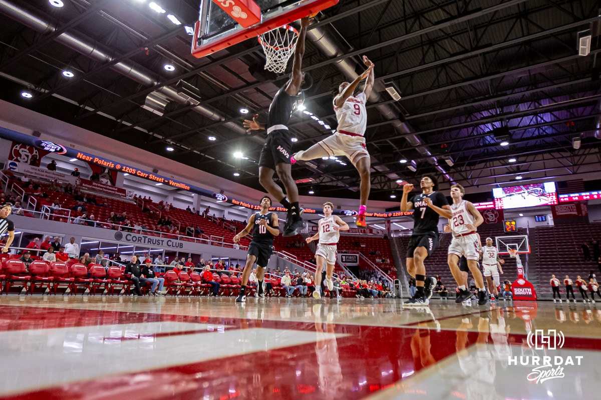 Omaha Mavericks guard Ja'Sean Glover (5) makes a dunk against South Dakota Coyotes guard Chase Forte (9) in the second half during a college basketball game, Wednesday, January 29, 2025, in Vermillion, South Dakota. Photo by John S. Peterson.