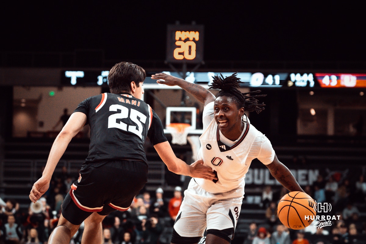 UNO MBB v Denver 2025-02-01 UNO Mavericks player, JJ White, dribbles past Denver opponent during a college basketball game on Feb 01, 2025 in Omaha, Nebraska. Photo by Logan Hock