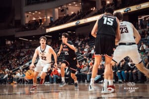 UNO Mavericks player, Tony Osburn, drives to the paint during a college basketball game on Feb 01, 2025 in Omaha, Nebraska. Photo by Logan Hock