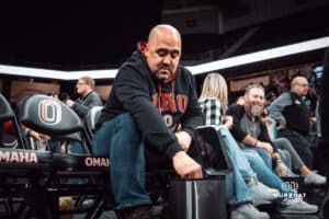 UNO Mavericks fan enjoys some popcorn from an odd container during a college basketball game on Feb 01, 2025 in Omaha, Nebraska. Photo by Logan Hock