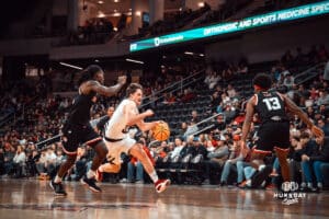UNO Mavericks player, Tony Osburn, drives to the paint during a college basketball game on Feb 01, 2025 in Omaha, Nebraska. Photo by Logan Hock