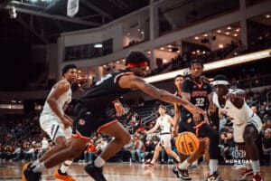 UNO Mavericks player, Ja'Sean Glover, runs toward a loose ball during a college basketball game on Feb 01, 2025 in Omaha, Nebraska. Photo by Logan Hock