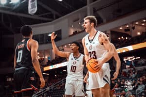 UNO Mavericks players, Marquel Sutton and Joshua Streit, celebrates an "and-one" during a college basketball game on Feb 01, 2025 in Omaha, Nebraska. Photo by Logan Hock