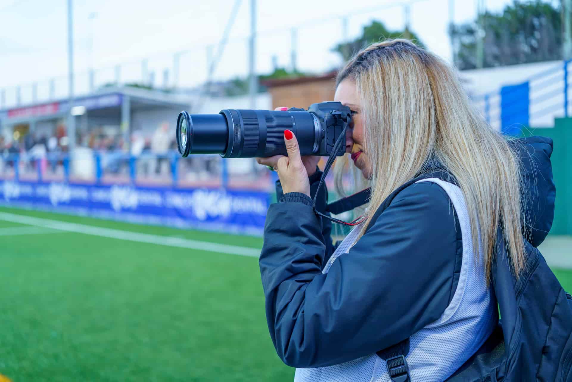 sports photographer on a field sports photographer on a field
