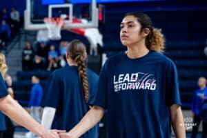 Creighton Bluejay Kiani Lockett and team wearing the shirt, "Lead Her Forward" in honor of National Girl's and Women's in Sports Day during a basketball game against the Providence Friars at Sokol Arena on Sunday, February 02, 2025, in Omaha, Nebraska. Photo by Collin Stilen.