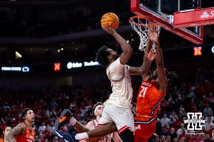 Nebraska Cornhuskers guard Brice Williams (3) makes a basket against Illinois Fighting Illini forward Morez Johnson Jr. (21) in overtime during a college basketball game, Thursday, January 30, 2025, in Lincoln, Nebraska. Photo by John S. Peterson.