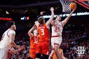 Nebraska Cornhuskers guard Rollie Worster (24) makes a layup against Illinois Fighting Illini forward Ben Humrichous (3) in the second half during a college basketball game, Thursday, January 30, 2025, in Lincoln, Nebraska. Photo by John S. Peterson.