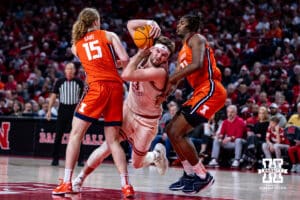Nebraska Cornhuskers forward Andrew Morgan (23) blasts between Illinois Fighting Illini forward Jake Davis (15) and forward Morez Johnson Jr. (21) going for a layup in the second half during a college basketball game, Thursday, January 30, 2025, in Lincoln, Nebraska. Photo by John S. Peterson.