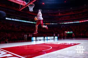 Nebraska Cornhuskers Heinrich Haarberg makes dunk at halftime for the football team's dunk contest during a college basketball game against the Illinois Fighting Illini, Thursday, January 30, 2025, in Lincoln, Nebraska. Photo by John S. Peterson.