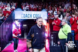 Retiring volleyball head coach John Cook passes walks out to be recognized by the fans at the first media break during a college basketball game against the Illinois Fighting Illini, Thursday, January 30, 2025, in Lincoln, Nebraska. Photo by John S. Peterson.
