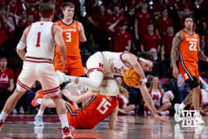 Nebraska Cornhuskers forward Andrew Morgan (23) gets tripped up dribbling the ball down the court against Illinois Fighting Illini forward Jake Davis (15) in the first half during a college basketball game, Thursday, January 30, 2025, in Lincoln, Nebraska. Photo by John S. Peterson.