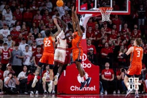 Nebraska Cornhuskers forward Juwan Gary (4) fights for a layup against Illinois Fighting Illini guard Tre White (22) and forward Morez Johnson Jr. (21) in the first half during a college basketball game, Thursday, January 30, 2025, in Lincoln, Nebraska. Photo by John S. Peterson.
