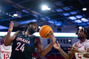 Omaha Mavericks center Isaac Ondekane (24) grabs the rebound against South Dakota Coyotes guard Chase Forte (9) in the second half during a college basketball game, Wednesday, January 29, 2025, in Vermillion, South Dakota. Photo by John S. Peterson.