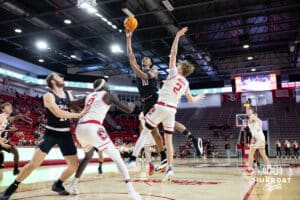 Omaha Mavericks forward Marquel Sutton (10) makes a layup against South Dakota Coyotes guard Shey Eberwein (2) in the second half during a college basketball game, Wednesday, January 29, 2025, in Vermillion, South Dakota. Photo by John S. Peterson.