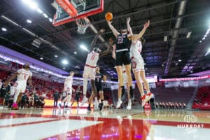 Omaha Mavericks forward Joshua Streit (23) reaches for the rebound against South Dakota Coyotes forward Mayuom Buom (0) in the second half during a college basketball game, Wednesday, January 29, 2025, in Vermillion, South Dakota. Photo by John S. Peterson.