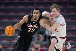 Omaha Mavericks forward Kamryn Thomas (22) dribbles the ball against South Dakota Coyotes guard Shey Eberwein (2) in the first half during a college basketball game, Wednesday, January 29, 2025, in Vermillion, South Dakota. Photo by John S. Peterson.