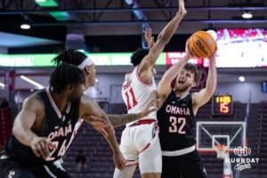 Omaha Mavericks guard Tony Osburn (32) drives to the basket against South Dakota Coyotes guard Dre Bullock (11) in the first half during a college basketball game, Wednesday, January 29, 2025, in Vermillion, South Dakota. Photo by John S. Peterson.