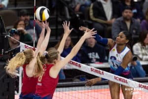 Omaha Supernova Kelsie Payne (11) spikes the ball against Grand Rapids Rise Carli Snyder (4) and Marin Grote (8) during a professional volleyball match Sunday, March 30, 2025 in Omaha, Nebraska. Photo by John S. Peterson.
