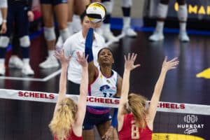 Omaha Supernova Kelsie Payne (11) pikes the ball against Grand Rapid Rise Carli Snyder (4) and Rapid Rise Marin Grote (8) during a professional volleyball match Sunday, March 30, 2025 in Omaha, Nebraska. Photo by John S. Peterson.