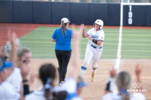 Creighton Bluejays Sydney Potter celebrates a home run during a college softball game against UCONN on March 28th, 2025 in Omaha, Nebraska. Photo by Brandon Tiedemann.