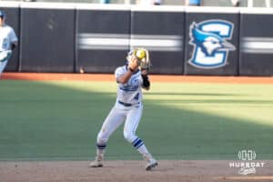 Creighton Bluejays Ashten Pierson catches a pop up during a college softball game against UCONN on March 28th, 2025 in Omaha, Nebraska. Photo by Brandon Tiedemann.
