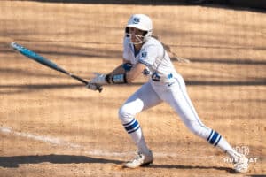 Creighton Bluejays Sydra Seville watches the ball during a college softball game against UCONN on March 28th, 2025 in Omaha, Nebraska. Photo by Brandon Tiedemann.
